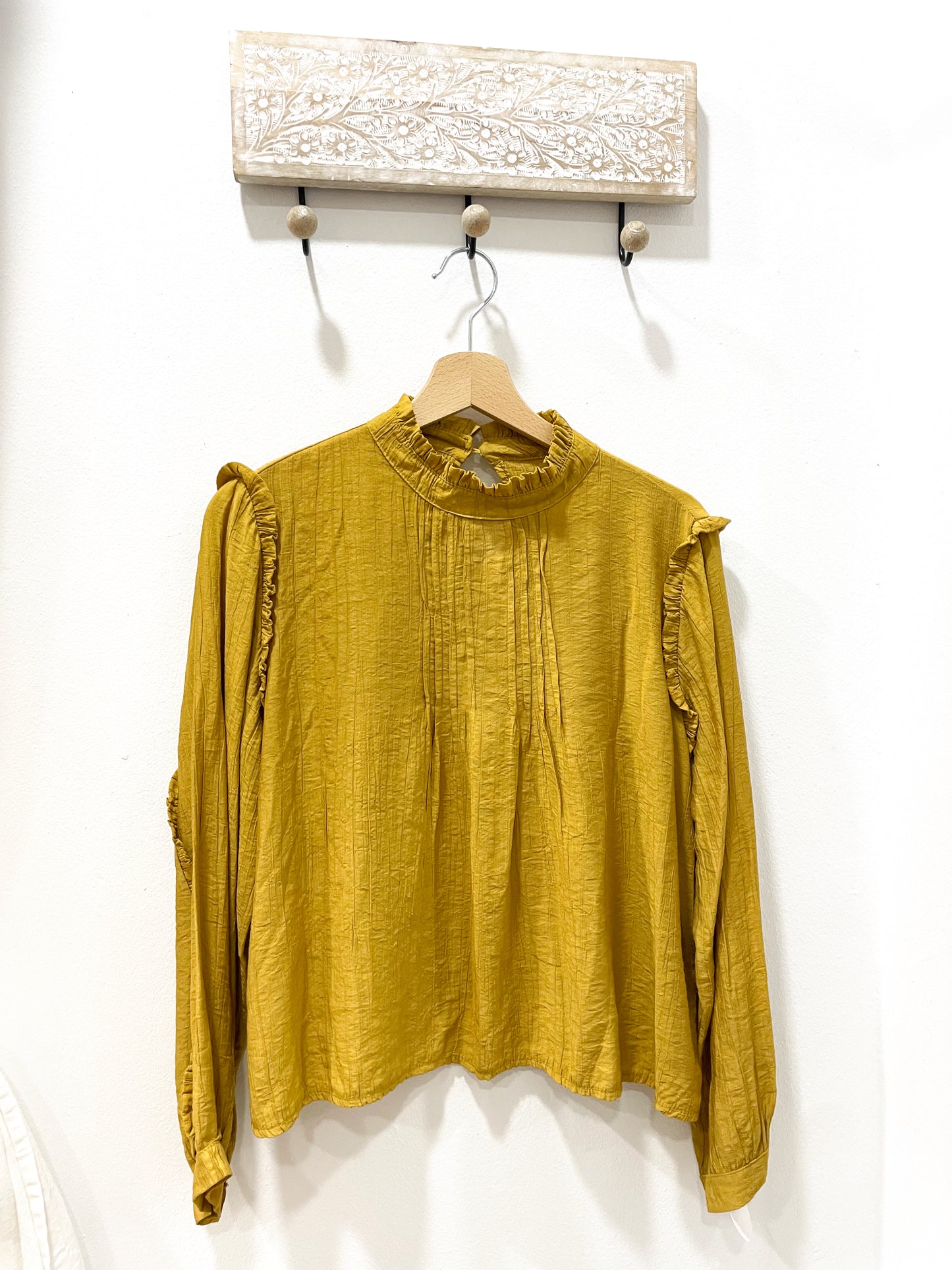 Blusa mostaza plisado