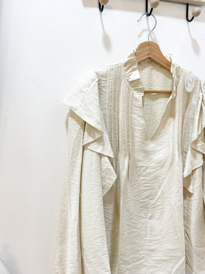 Blusa beige volante
