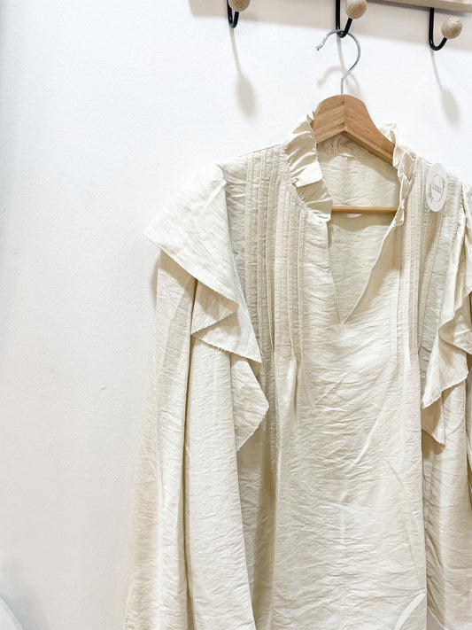 Blusa beige volante