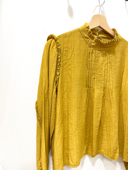 Blusa mostaza plisado