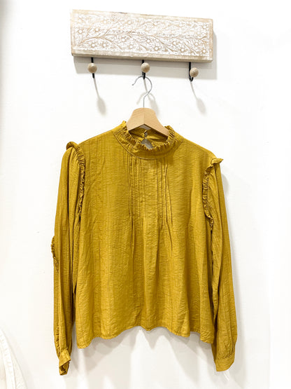 Blusa mostaza plisado